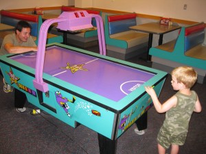 Dylan and Lukas Playing Air Hockey Dylan and Lukas Playing Air Hockey
